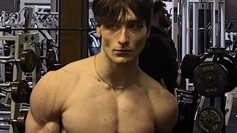 Young man flexing muscles