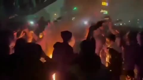 IRAN: Tehran, women removing their veils and burning them, a powerful symbol of liberation