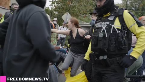 Woman receives medical attention from protesters after what some described as fall,