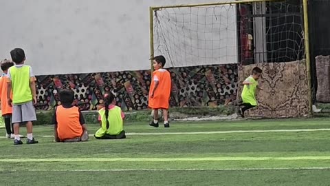 Young Goalkeeper Dives to the Wrong Side