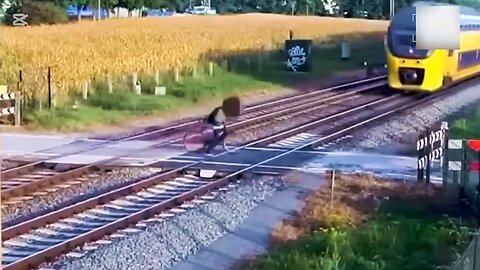 Cyclist Crosses Tracks Just Before Train Arrives – Lucky to Be Alive😱🤯