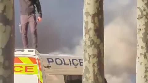 A Muslim man set fire to a Police van before holding up the Quran