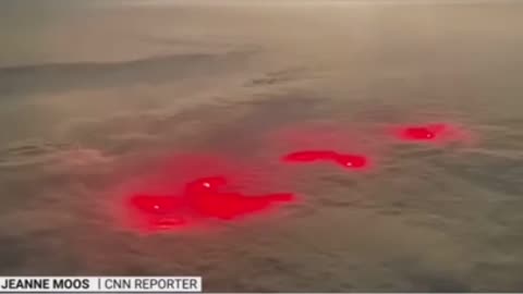 A strange red glow was filmed by a pilot as he traveled over the Pacific ocean