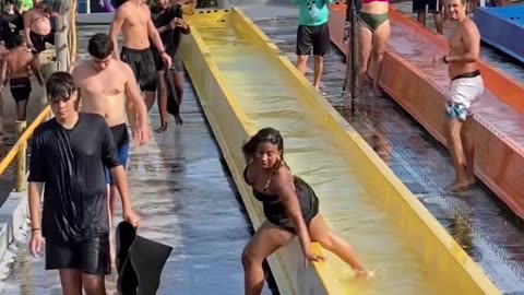 Woman Falls Flat At Waterslide Exit