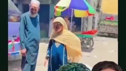 A young pregnant girl is seen shopping with her elderly husband in Pakistan