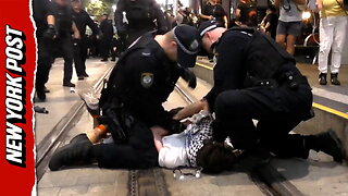 Police repeatedly punch protester during clashes in Sydney