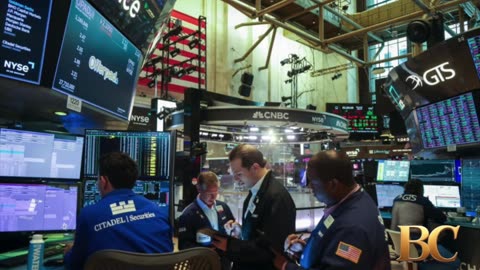 Wall Street ticks to records