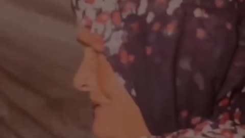 Little girl shivers why she clings to her grandfather for warmth. (Gaza)