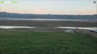 Foggy over the water with sun on the way