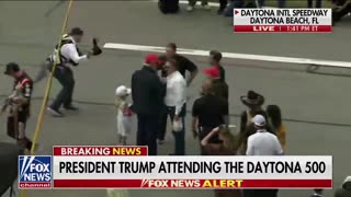 President Donald Trump is greeted with massive applause at the Daytona 500 as he walks the track and greets the drivers