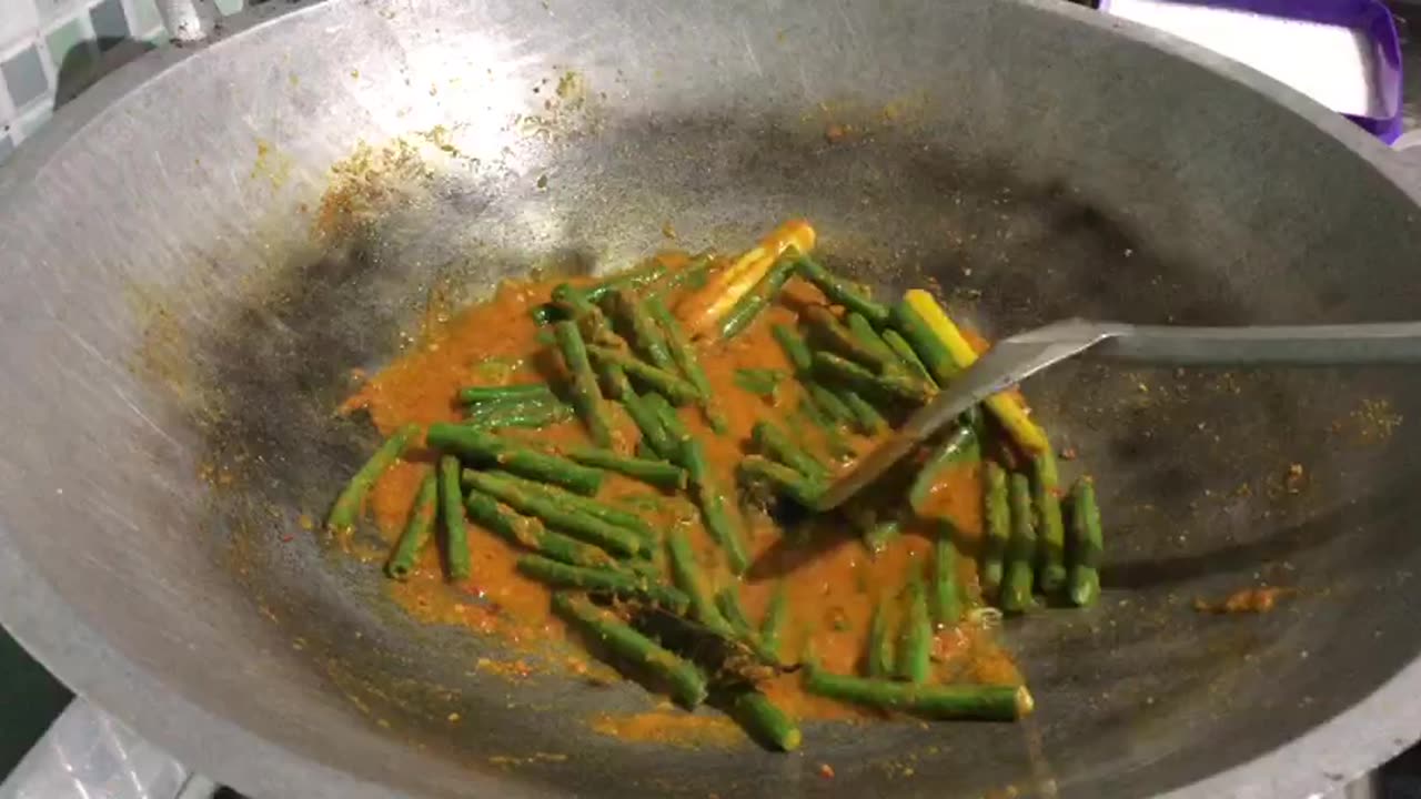 First Step: Stir-Frying Spices for Curry with Long Beans