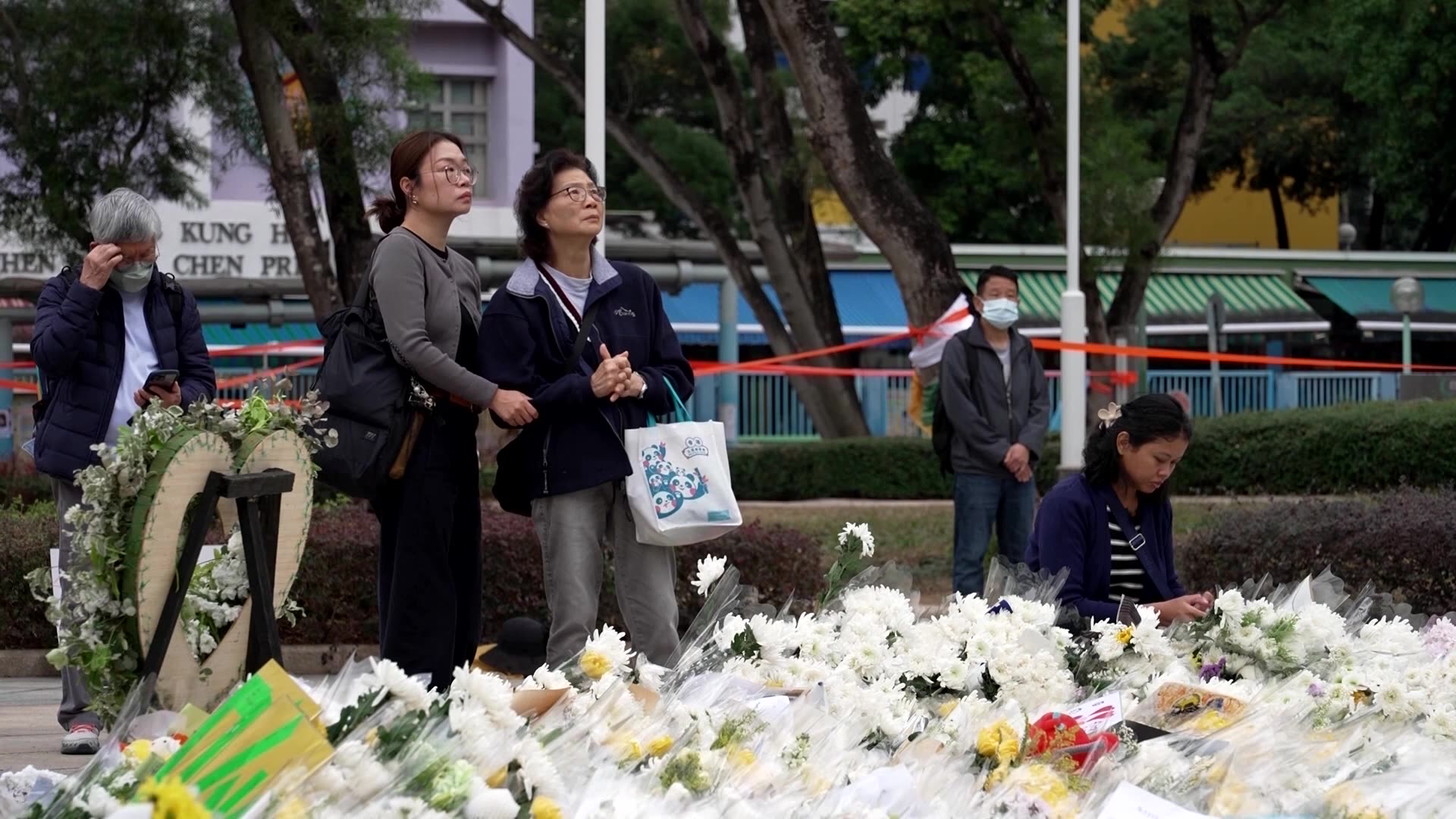 Hong Kong fire survivors allowed brief return to collect belongings