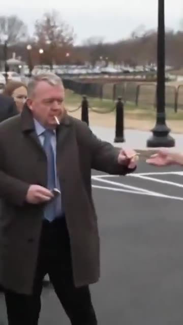 Danish Foreign Minister Lars Løkke Rasmussen calming down with a cigarette