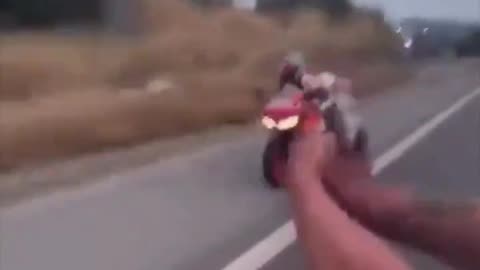 Man fires shots at motorcycle rider