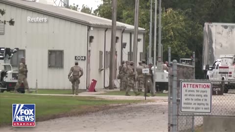 Texas National Guard troops arrive at an Army Reserve Training Center near Chicago.