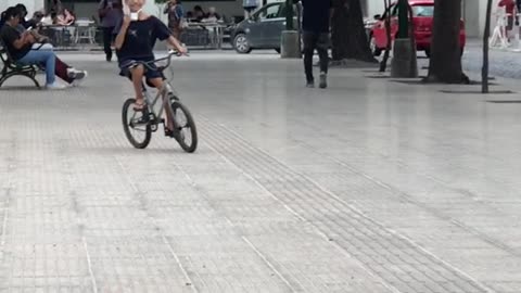 Boy Falls From Bike And Spills Mate