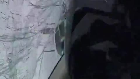 Dashcam footage captures moment high winds flipped a board onto a vehicle's