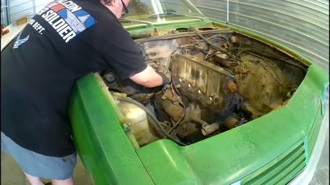 75 Chevy Vega - Off with the hood and bald spots.