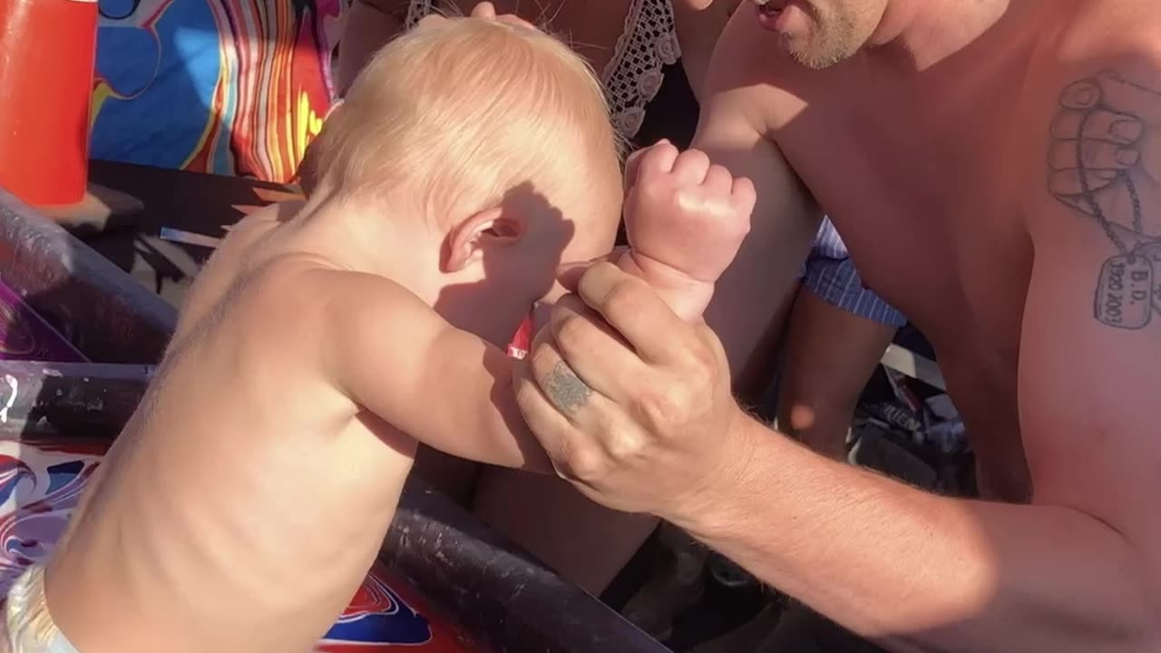 Dipping a Baby in Paint