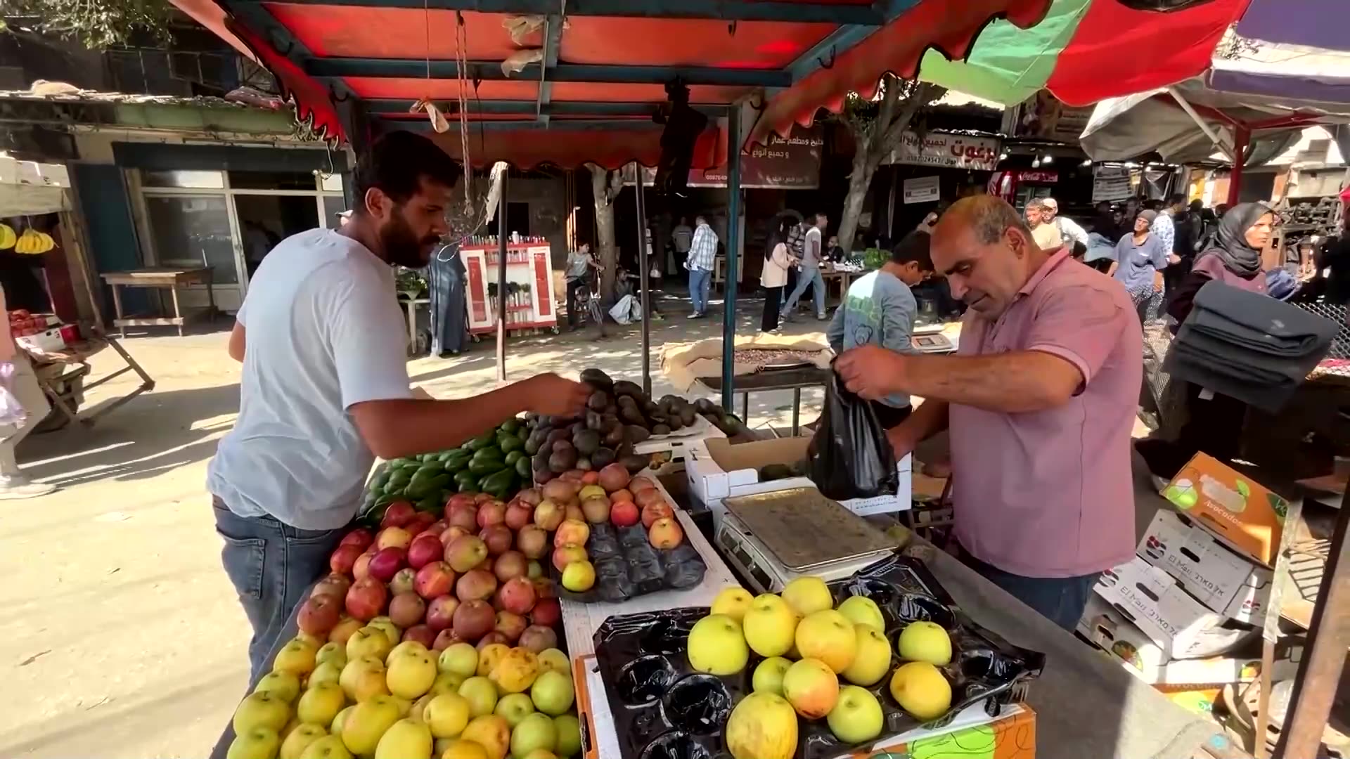 Gazans repair torn banknotes and wait in line as cash crisis deepens
