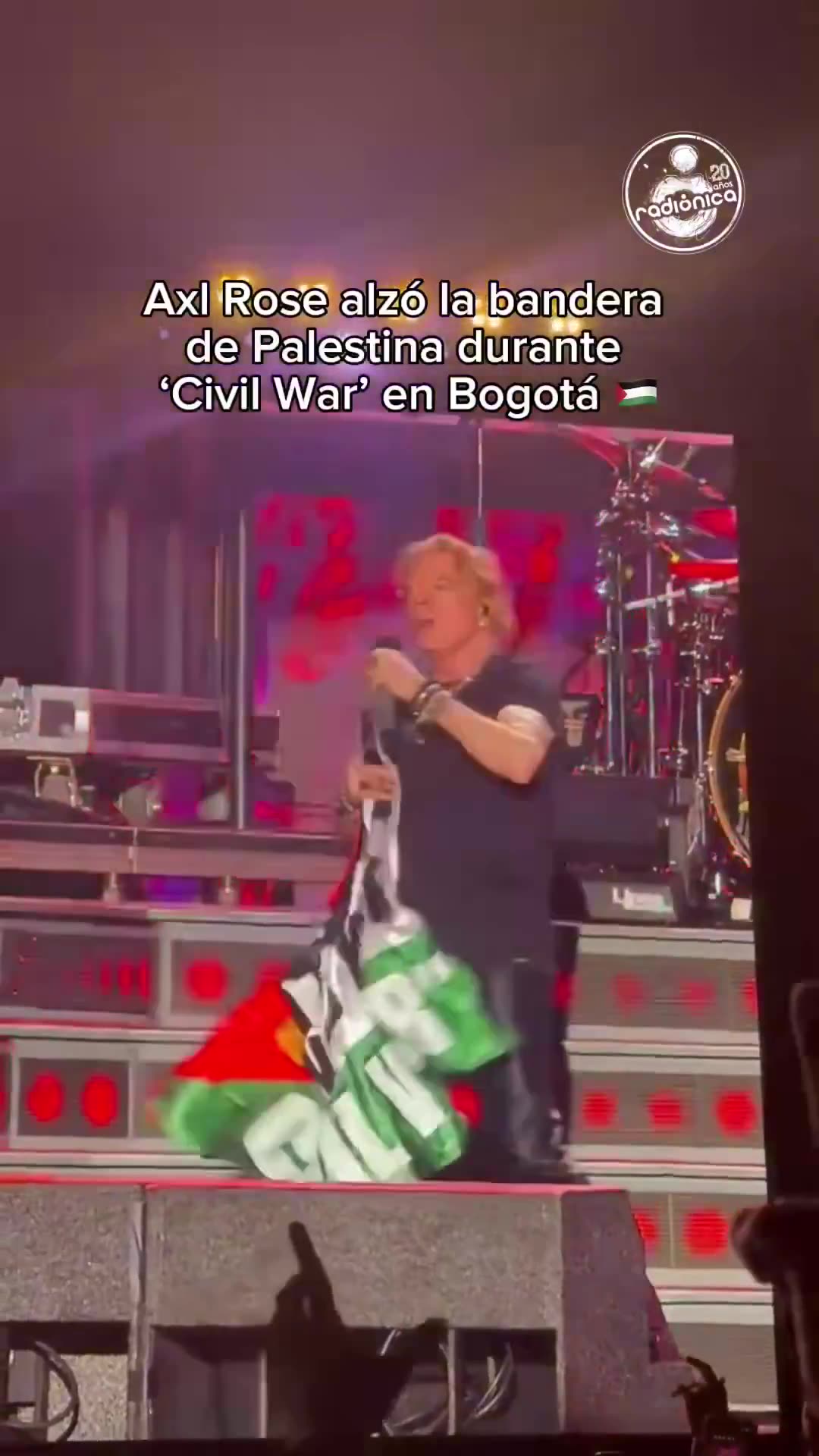 Guns N’ Roses singer Axl Rose brandishes a Palestinian flag on stage during Bogota