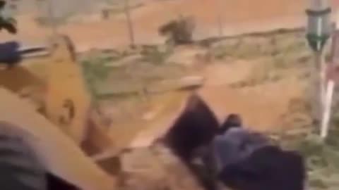 Jewish Zionist Israeli female soldier sings as dead palestinians get bulldozed.