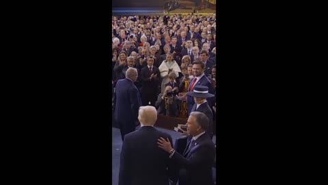 Melania's hat comes between kiss with Donald Trump at inauguration