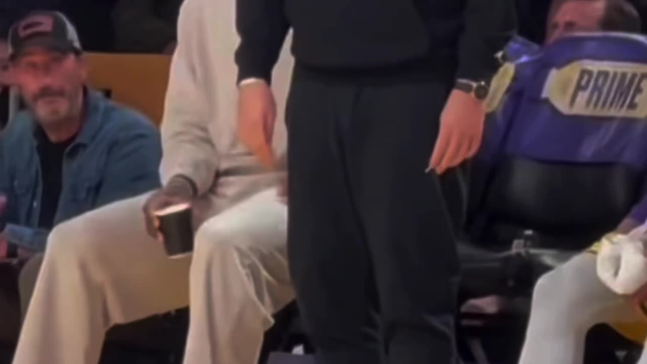 Luka doncic and LeBron courtside cheering on their teammates