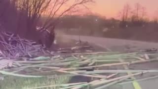 Lumber truck loses load off of bridge and his traffic underneath