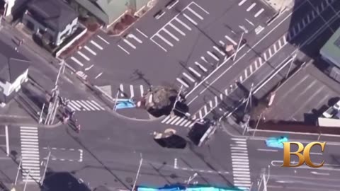 Fears grow in Japan for truck driver trapped in sinkhole for third day