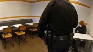 New footage shows police approaching Luigi Mangione inside a McDonald’s and asking