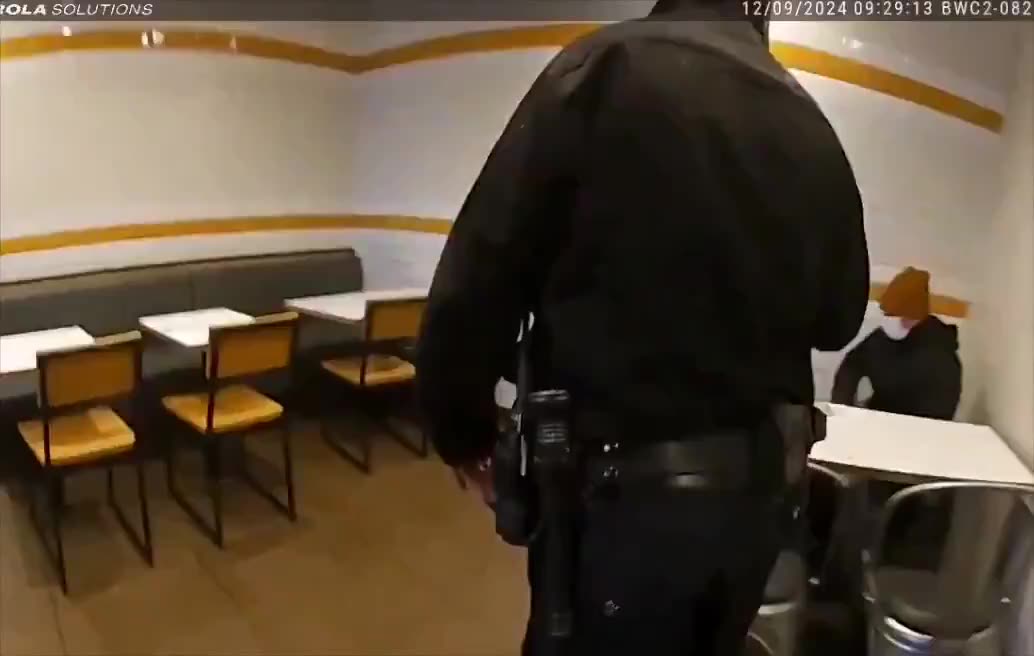 New footage shows police approaching Luigi Mangione inside a McDonald’s and asking