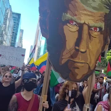 New Yorkers marching: "ARREST NETANYAHU. STOP THE GENOCIDE."