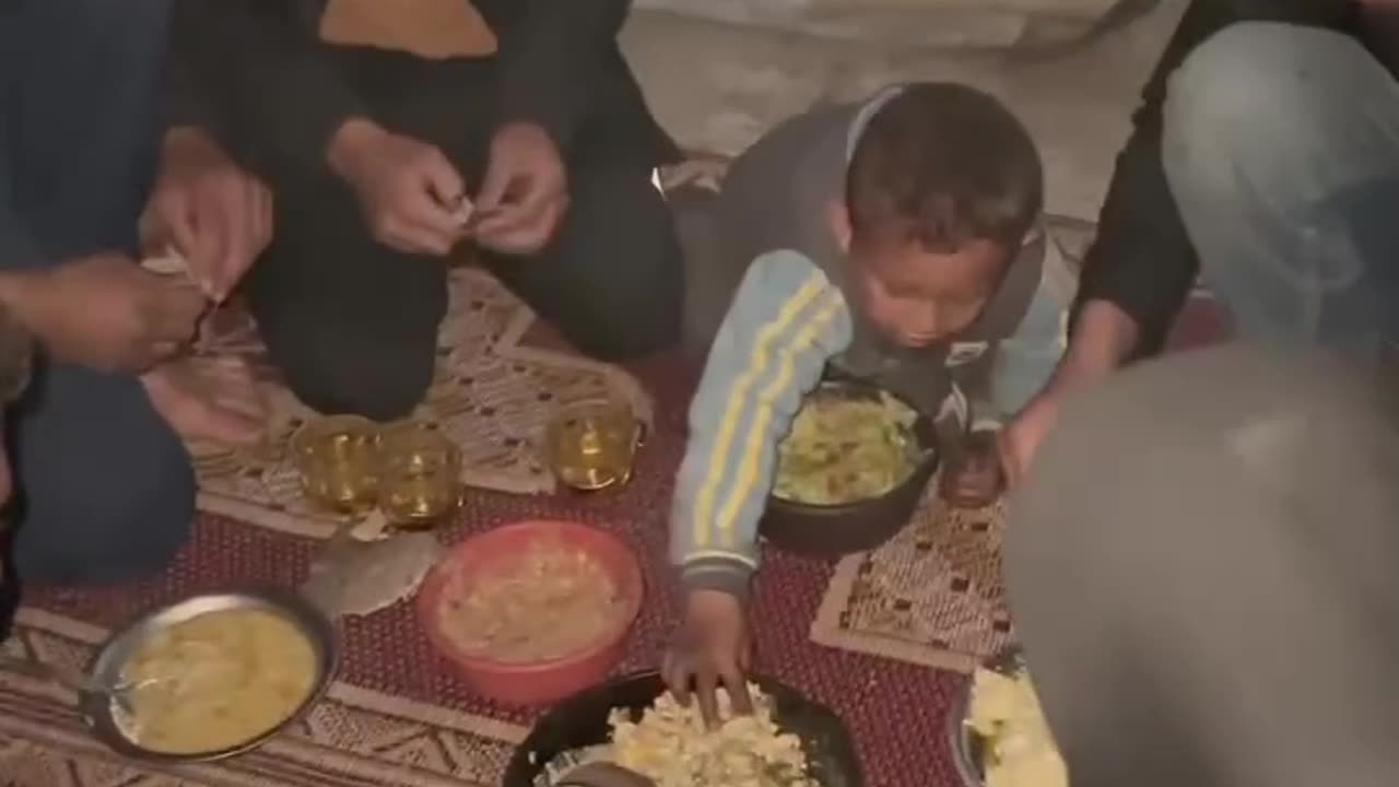 A family sets up their Ramadan iftar meal amid the rubble in Beit Lahia