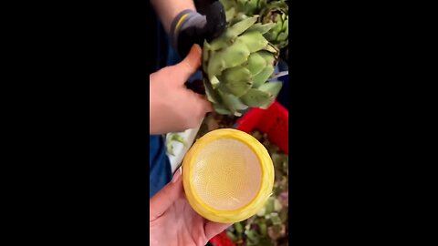 Have you ever seen an artichoke heart be cut from the plant before?