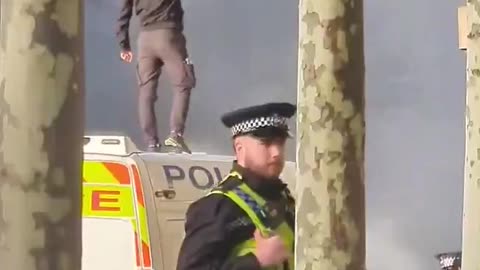 A Muslim man set fire to a Police van before holding up the Quran