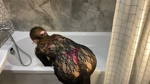 Tub cleaning in transparent dress