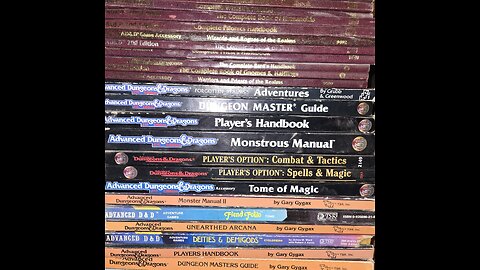 RPG book collection with some minis and terrain