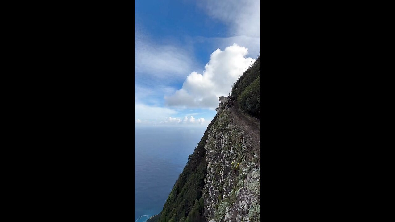 Cycling beside the mountain slope