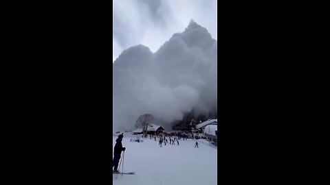 Dramatic video captured a massive avalanche powder cloud surging toward skiers near the chairlift