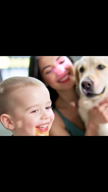 ♡A little boy eating a hamburger and a retriever dog.