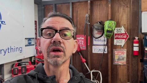 Mechanic Examines GearWrench Instruments New Tools for Scan