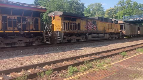 Union Pacific Coal Train crawls upgrade eastbound towards St Louis, in Webster Groves Missouri