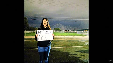 Woman holding a sign