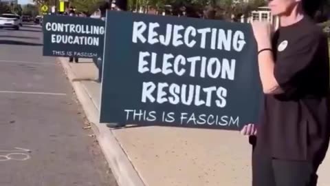 Liberals protest the Trump administration by holding up ‘fasclst signs’ Ironically,