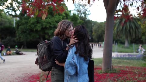 Cute Lesbian Couple Kissing in the Park
