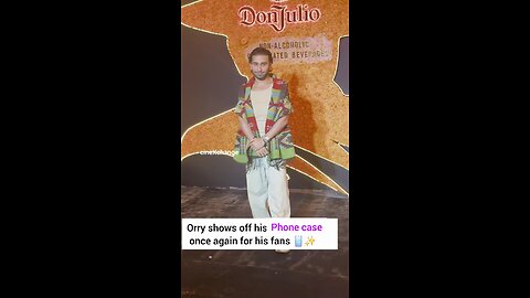 Orry shows off his phone case once again for his fans 📱✨Orry Avataramani at "Day of the Dead "