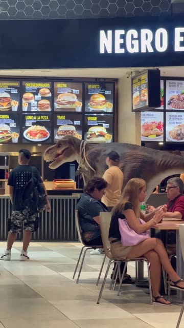 Man Walks Pet Dinosaur Through Mall