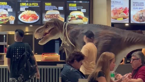 Man Walks Pet Dinosaur Through Mall