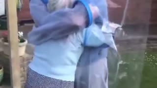 When propaganda replaces truth, people hug through plastic.